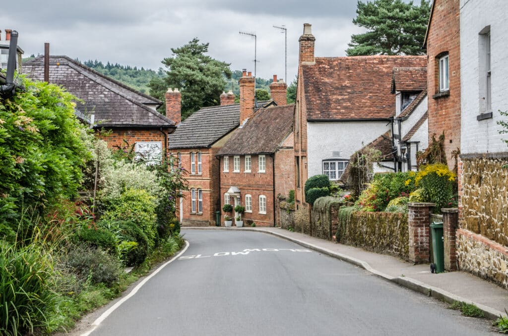Road going into Shere Village Surrey UK