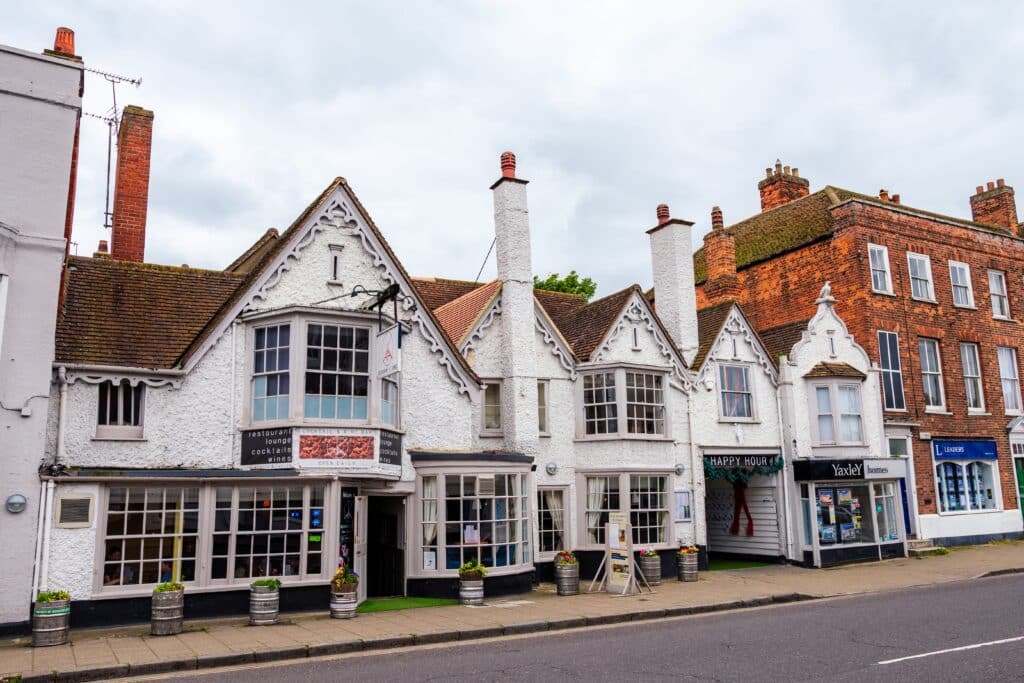Wide view of the traditional city architecture on the high street in Witham town with no people on the street