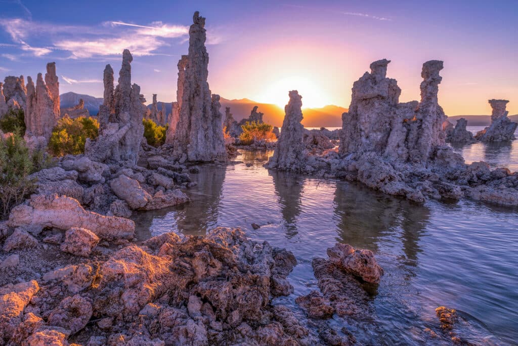Mono Lake, a large, shallow saline soda lake. Outliers - bizarre calcareous tufa rock formation at sunset in Mono County, California, USA