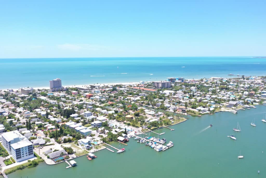 Drone photos of Fort Myers Beach on a sunny, cloudless day in May.
