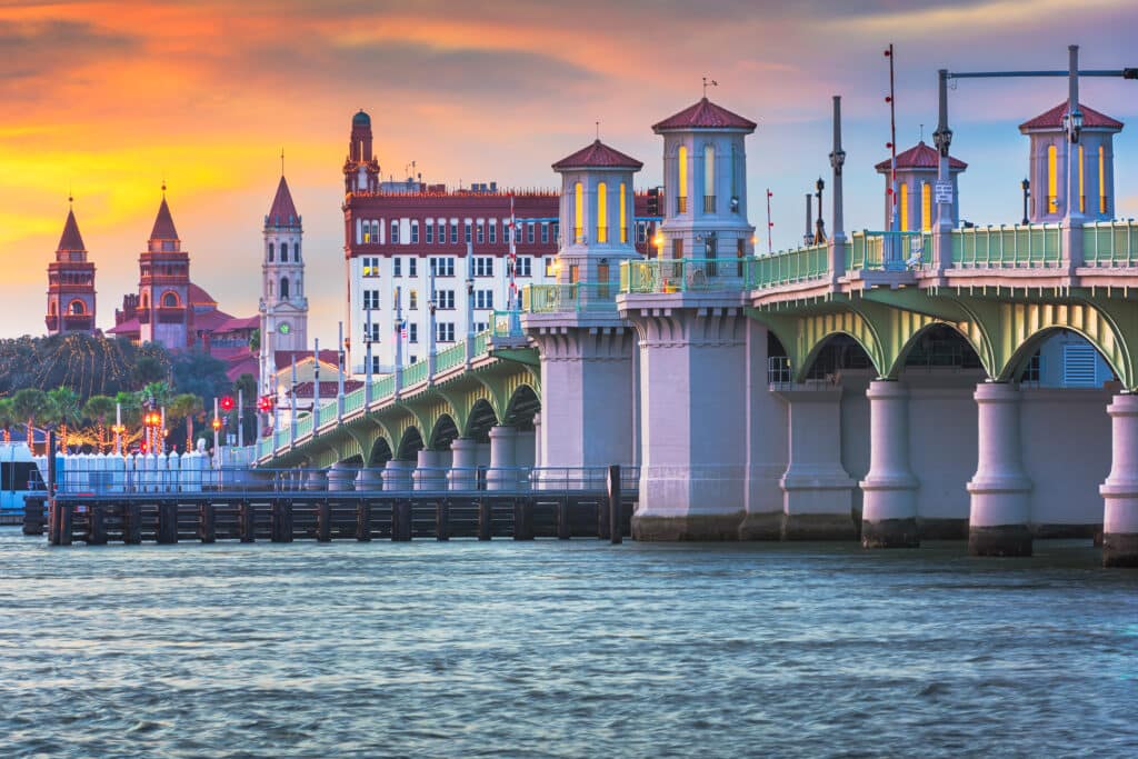 St. Augustine, Florida, USA city skyline and Bridge of Lions at dusk.