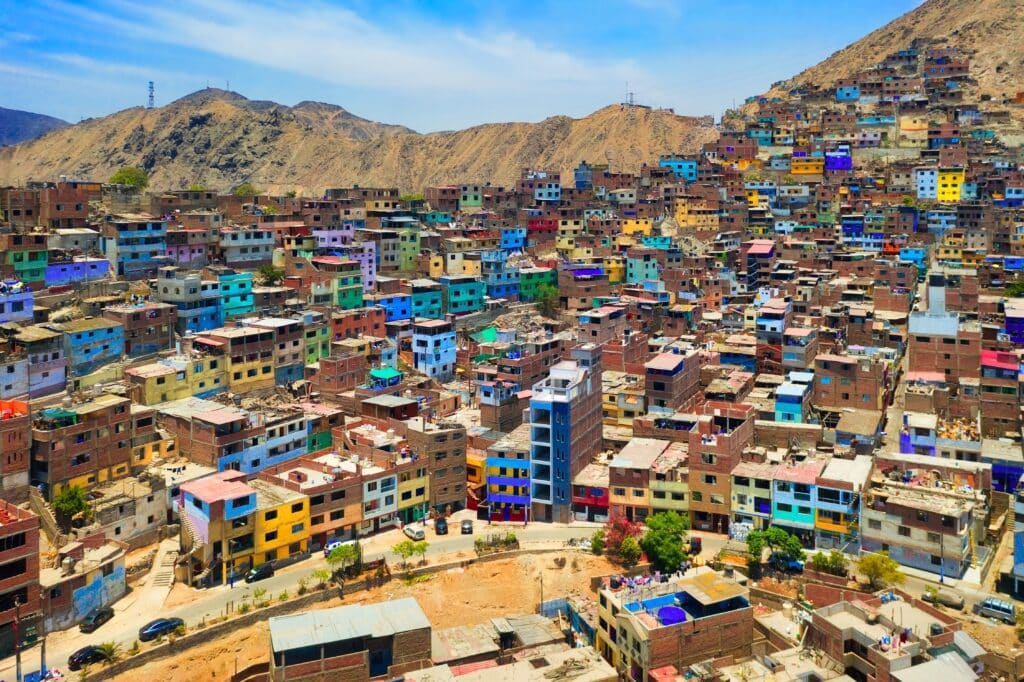Aerial view of the colorful houses in shanty town, Lima city, Peru