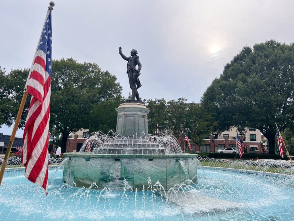 Lagrange, GA, United states: Lafayette Fountain,This historic fountain is part of the downtown Lagrange scenery.Us flag on independence day