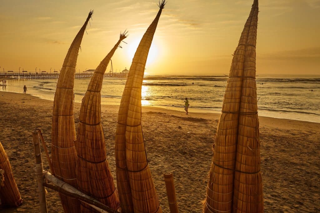 Huanchaco is a coastal town in Peru known for its unique reed boats, called "caballitos de totora".