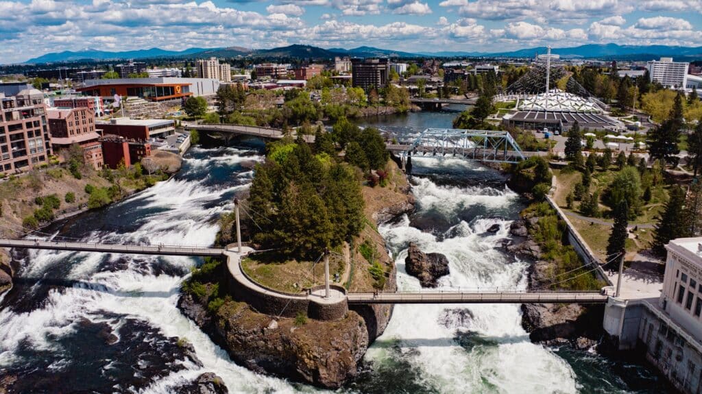 SPOKEANE, WA., USA - drone aerial view of downtown Spokeane Washington focuses on City Center with Waterfalls and river