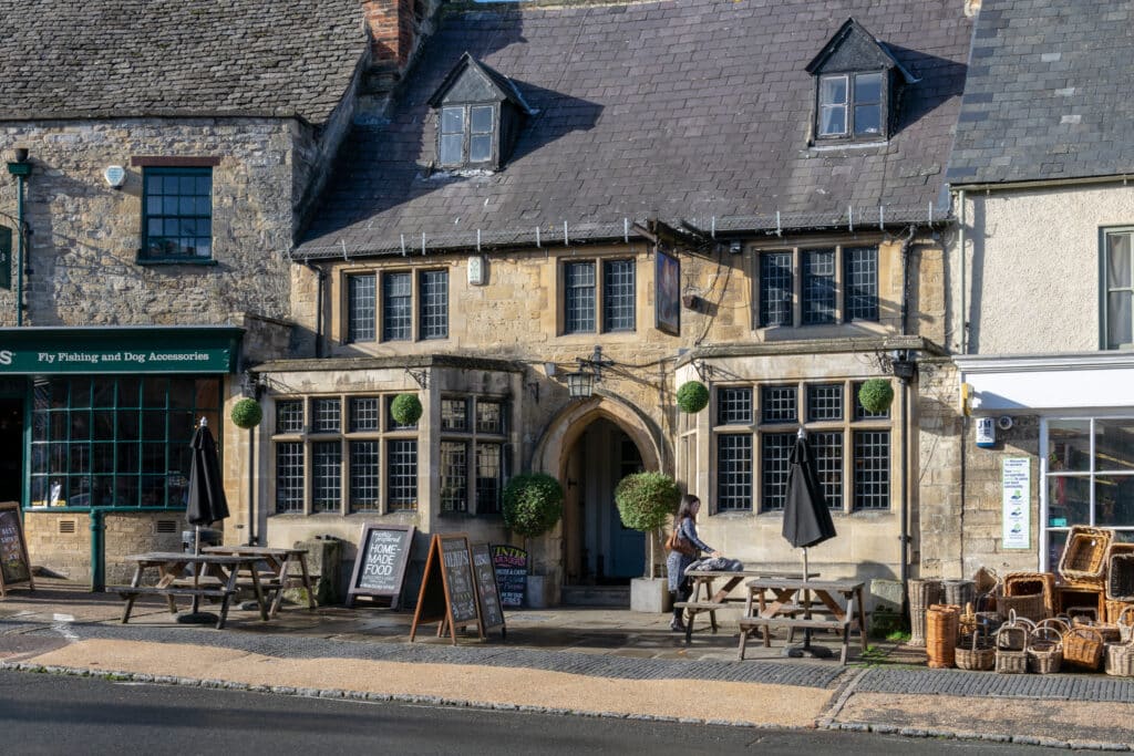 Burford, Oxfordshire / UK: View of The Mermaid Inn, High Street, Burford, Oxfordshire in the autumn