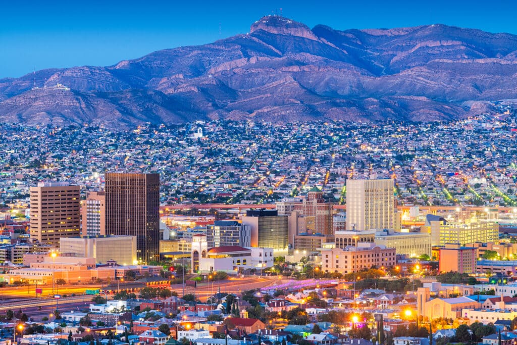 El Paso, Texas, USA downtown city skyline at dusk with Juarez, Mexico in the distance.