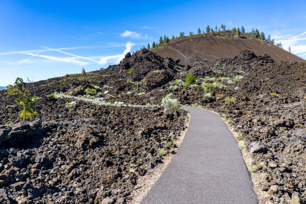 Newberry National Volcanic Monument: Trail of the Molten Lands is an easy 1 mi hike where you can wonder near Lava Butte, a cinder cone (volcano)