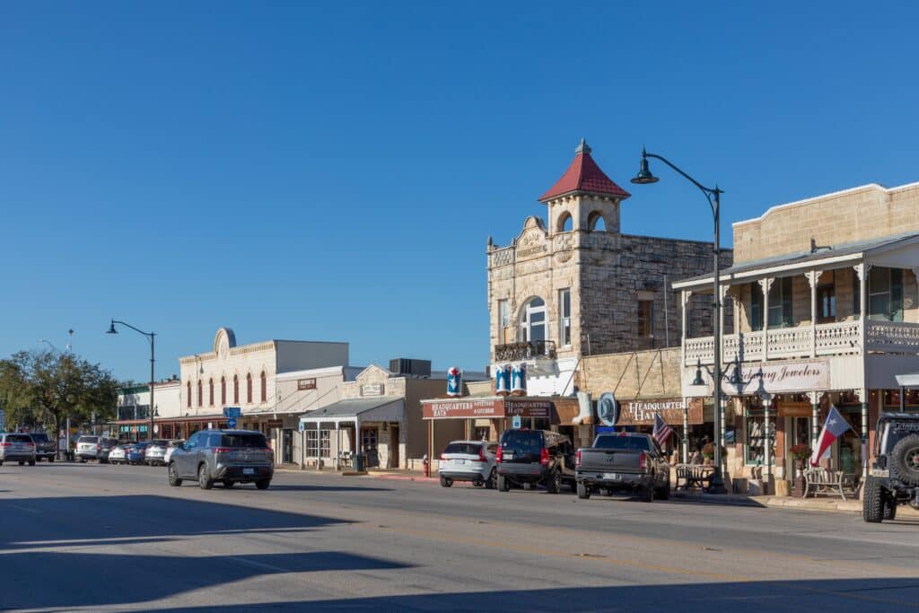 The Main Street in Fredericksburg, Texas, also known as The Magic Mile, with retail stores and people walking