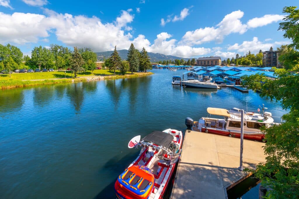 Boats dock along Sand Creek near the City Beach and Pend Oreille lake at the scenic waterfront small town of Sandpoint, Idaho, in the North Idaho panhandle