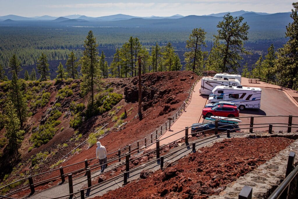 Bend, Oregon US: parking lot on top of Lava Butte, a prominent 500-foot tall cinder cone located in Central Oregon, within the Newberry National Volcanic Monument