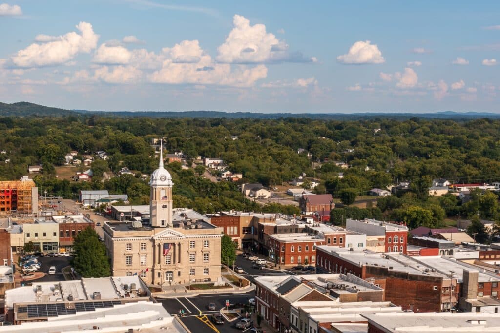 Aerial view of the historic Maury County Courthouse surrounded by the downtown square and residential neighborhoods in Columbia, Tennessee.