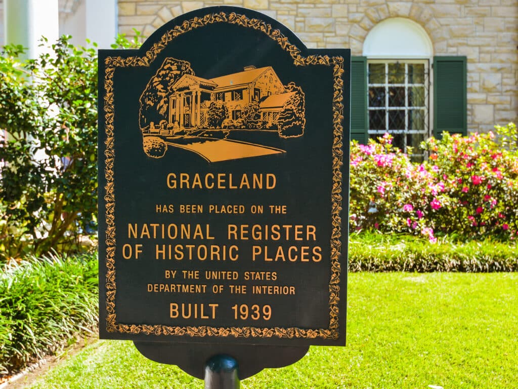 Marker in front of Elvis Presley's Graceland mansion indicating that the property has been placed in the National Register of Historic Places.
