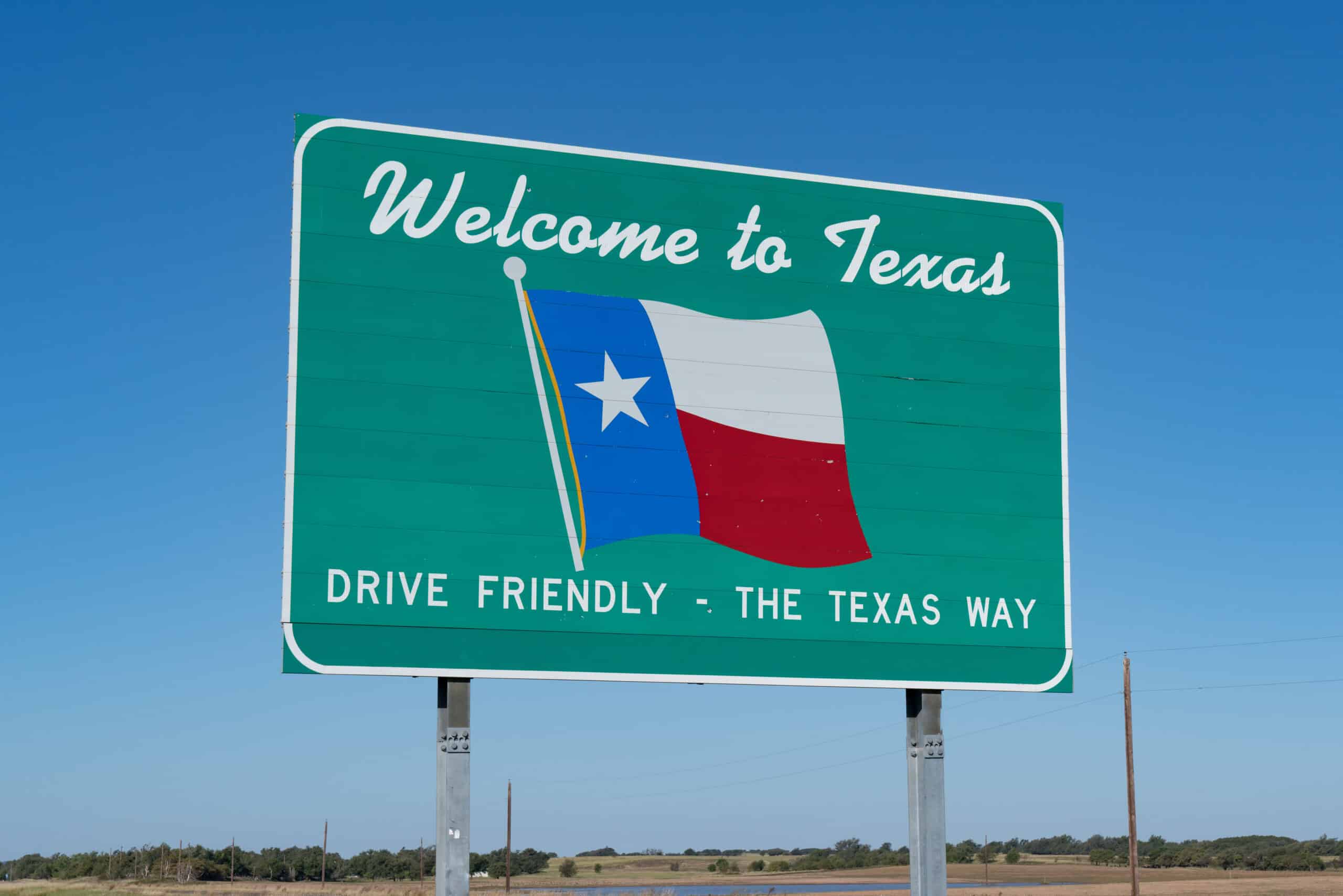 Welcome to Texas Sign on the road at the state border