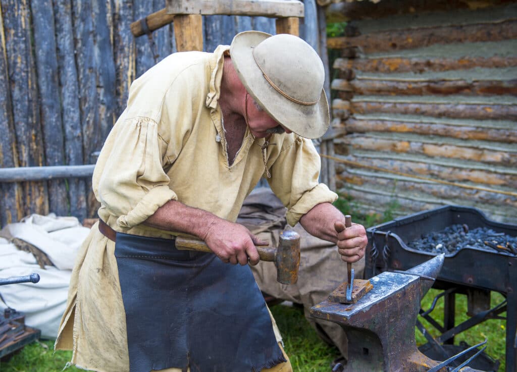 FORT BRIDGER , WYOMING: Blacksmithing demo during the Fort Bridger Rendezvous held in Fort Bridger Wyoming. Rendezvous is a mountain man celebration of the Fur Trade Era