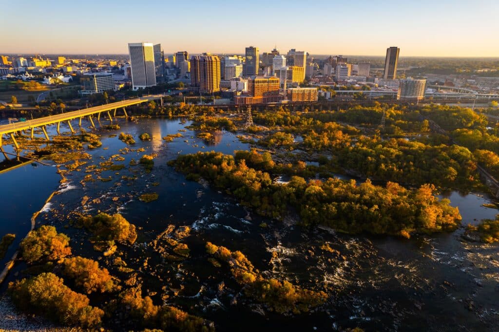 An aerial view of a beautiful orange sunrise over the James River, Richmond, Virginia, United States