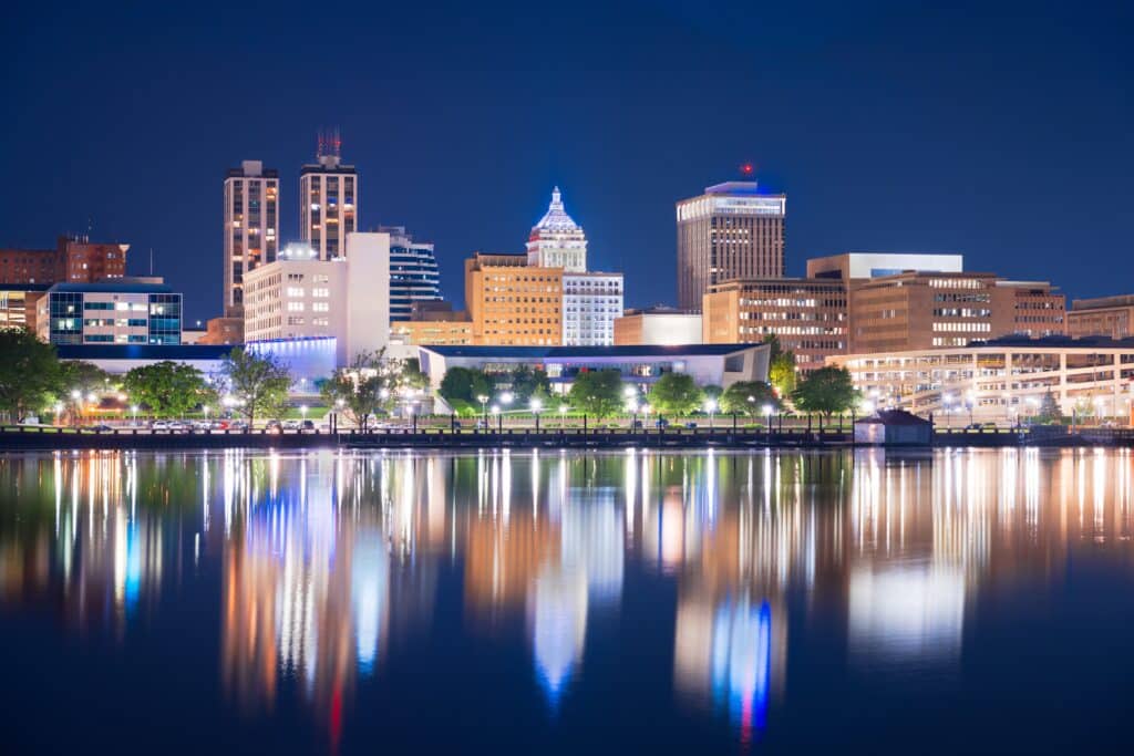 Peoria, Illinois, USA downtown skyline on the lake at dusk.