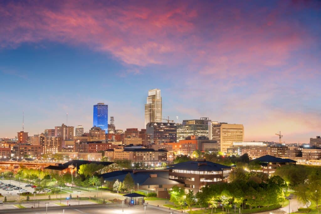 Omaha, Nebraska, USA downtown cityscape at dusk.