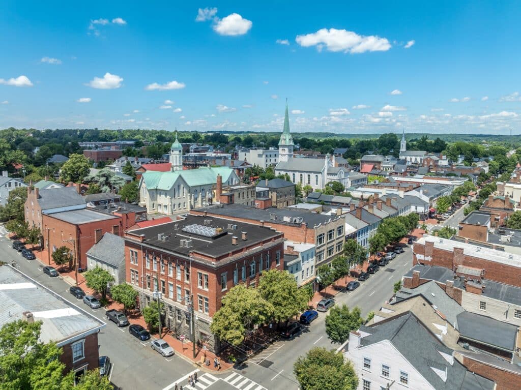 Aerial view Fredericksburg Virginia with Circuit Court building , historic business district, Baptist church, Chatham bridge over Rappahannock River