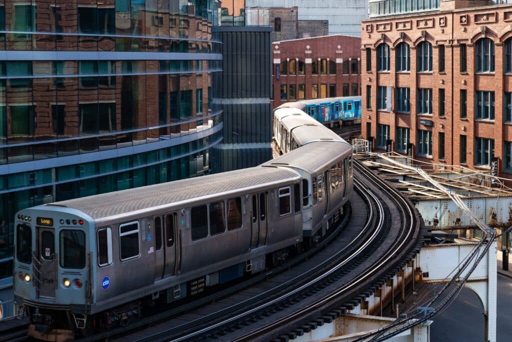 Commuter train weaving through downtown buildings in Chicago, Illinois, USA.