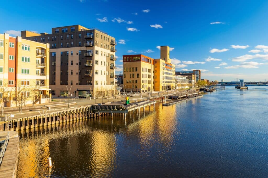 Green Bay, WI, USA: A picturesque view of downtown Green Bay's skyline along the Fox River at sunset