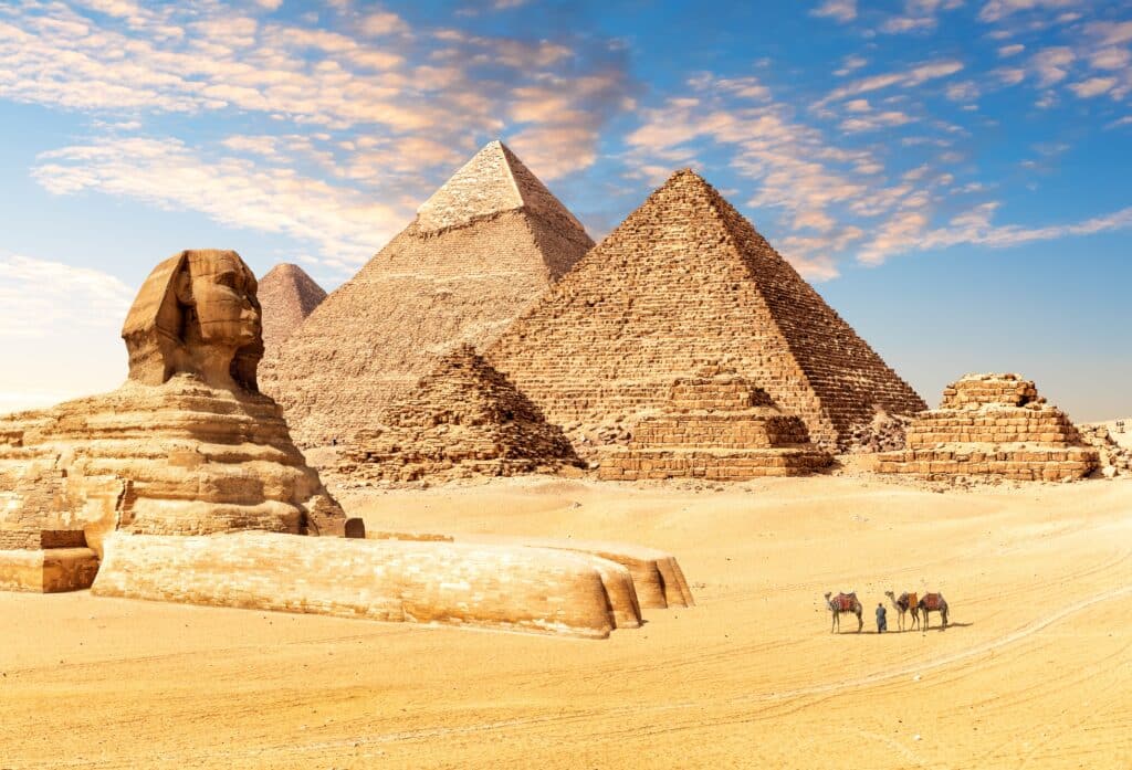 The Great Sphinx next to the Pyramids of Egypt in the desert of Giza