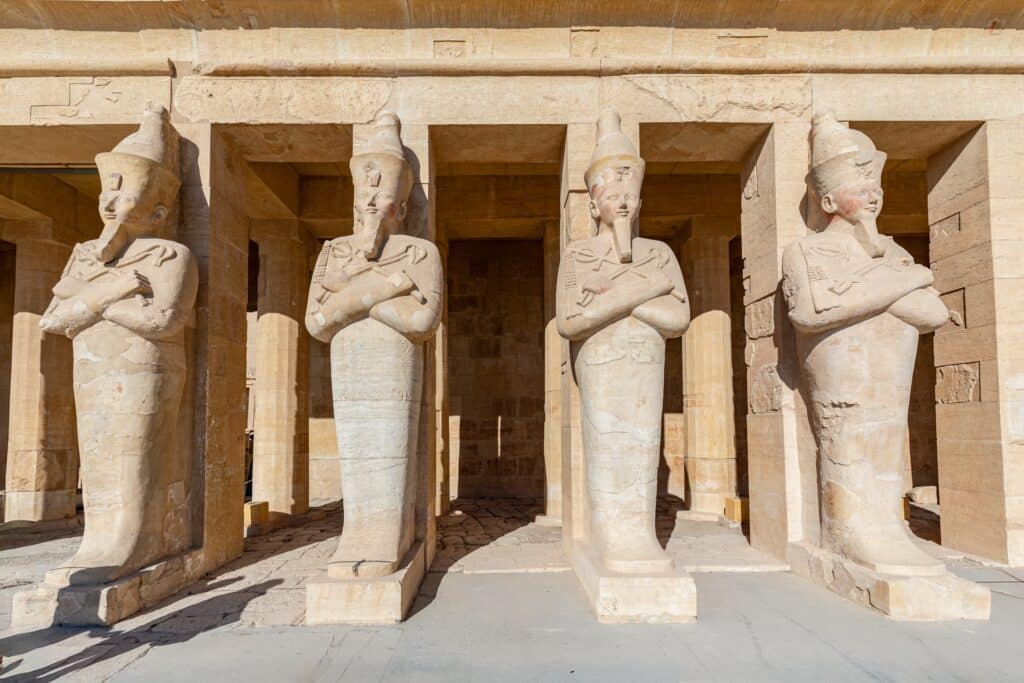 Osiris pillar in the mortuary temple of Hatshepsut in the necropolis Deir el-Bahari of Thebes, Egypt, Luxor. Sights in Egypt - travel, vacation, round trip