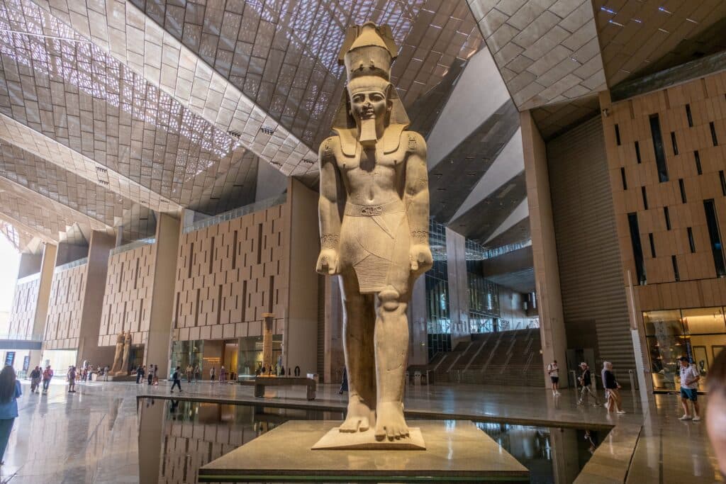 GIZA, EGYPT : Close-up of the colossal statue of Ramses II in the Grand Hall of the Grand Egyptian Museum (GEM)