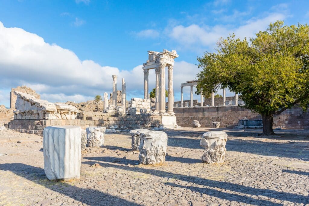 Columns of white marble on the remains of the ruins of the ancient temple of Troyan. The ancient city of Pergamon. Tourist attraction of Turkey.