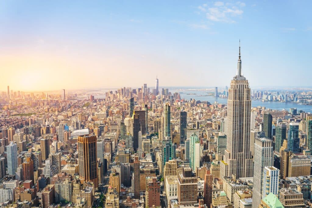 Amazing panorama view of New York city skyline and skyscraper at sunset. Beautiful cityscape in Midtown Manhattan.