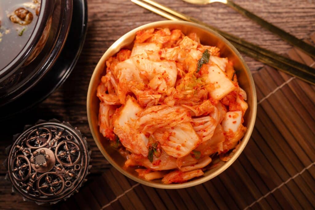 Kimchi fermented cabbage in a bowl with chili seasoning