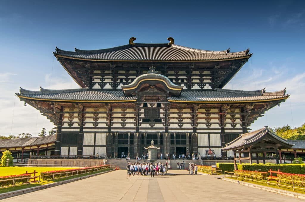 Front view of Todai-ji Great Buddha Hall with visitors approaching the temple